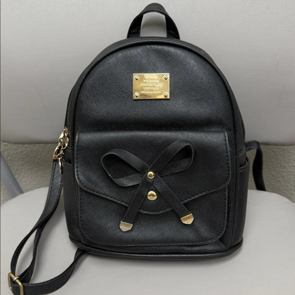 Black Backpack with Gold Accents